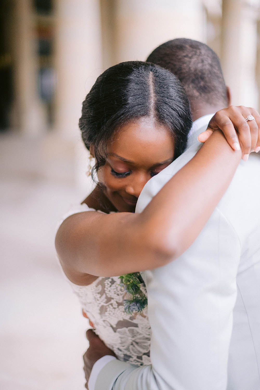 the bride hugs her husband